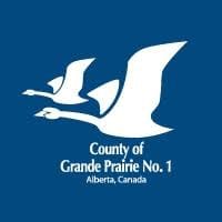 A blue background displays two white flying geese above the white text County of Grande Prairie No. 1 and Alberta, Canada.